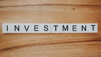 Investment Scrabble text by Precondo CA courtesy of Unsplash.